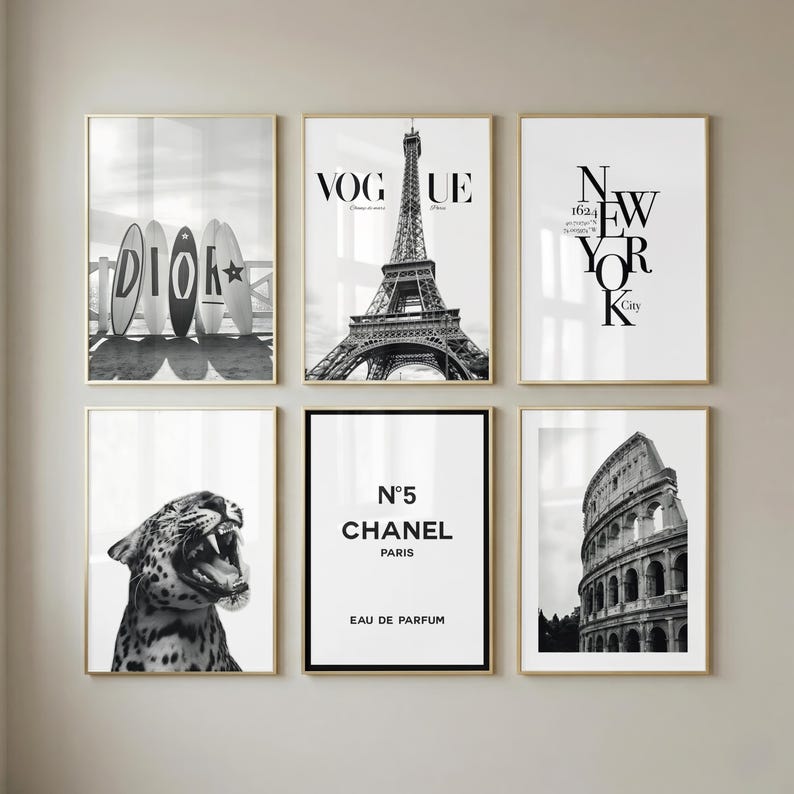 Six framed black and white posters arranged as a gallery wall